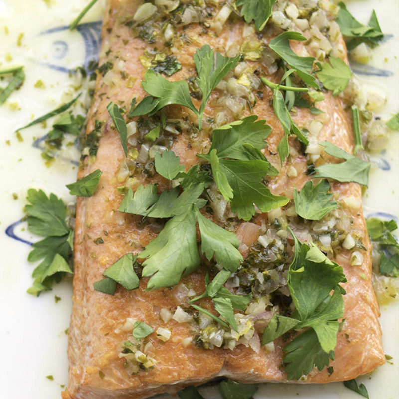 close up of salmon with parsley